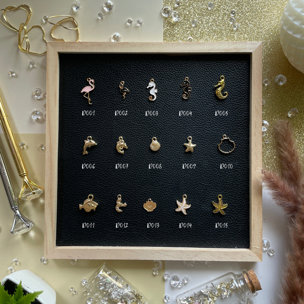 Golden rays, shells, and summer dreams—charms that bring beach days and sunshine into your pages.