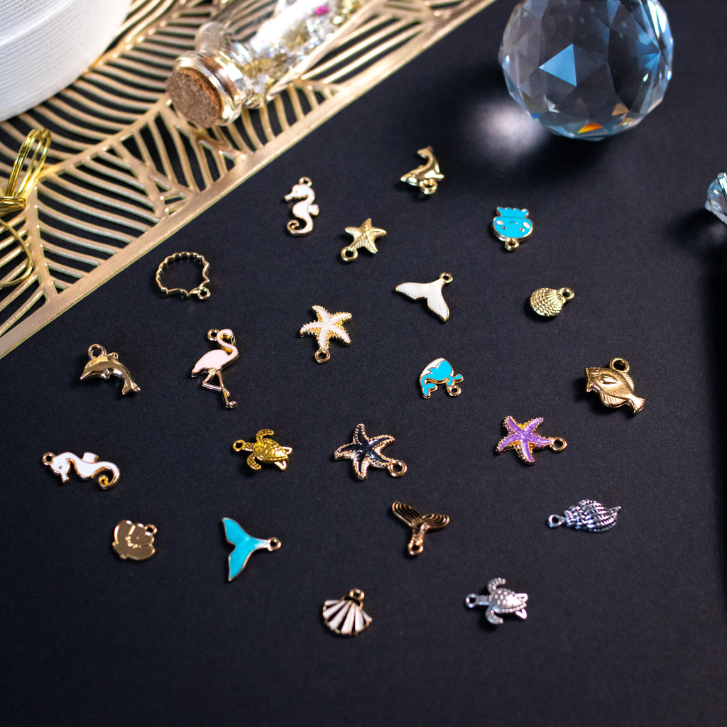 Golden rays, shells, and summer dreams—charms that bring beach days and sunshine into your pages.