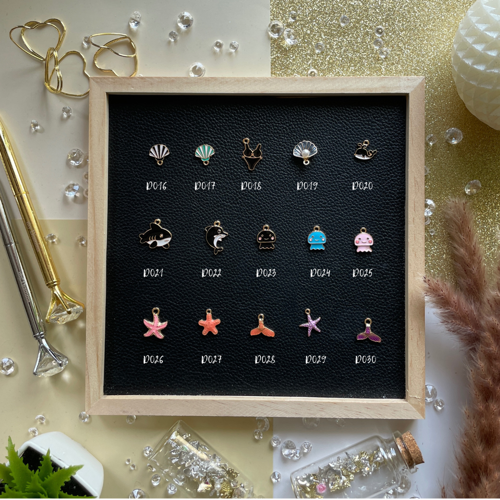 Golden rays, shells, and summer dreams—charms that bring beach days and sunshine into your pages.