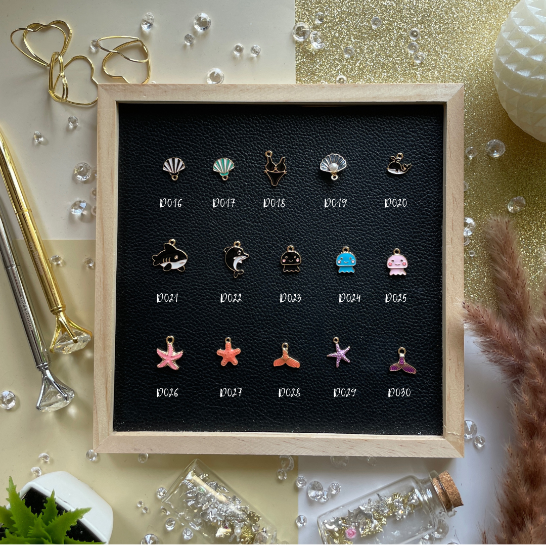 Golden rays, shells, and summer dreams—charms that bring beach days and sunshine into your pages.