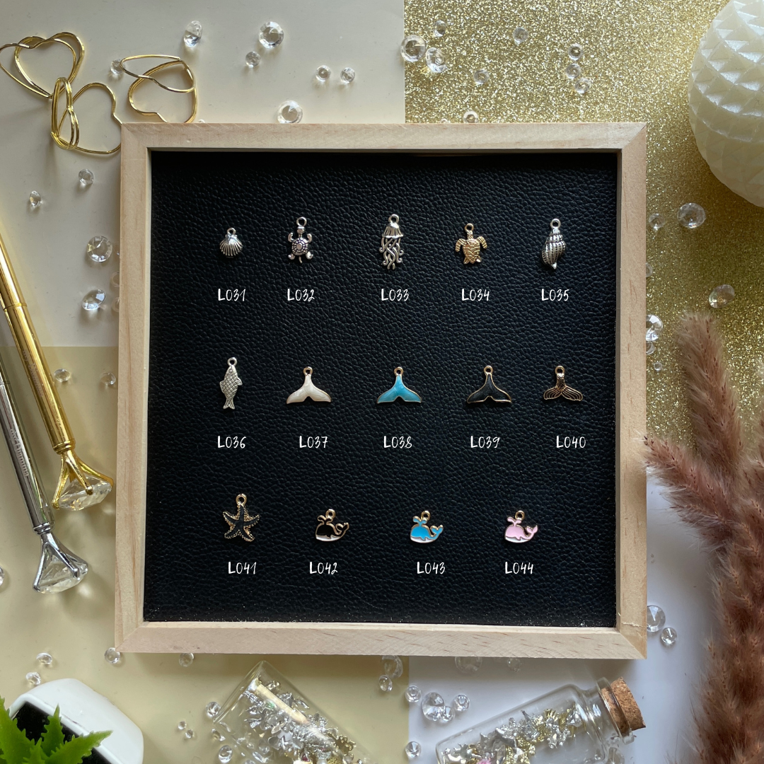 Golden rays, shells, and summer dreams—charms that bring beach days and sunshine into your pages.